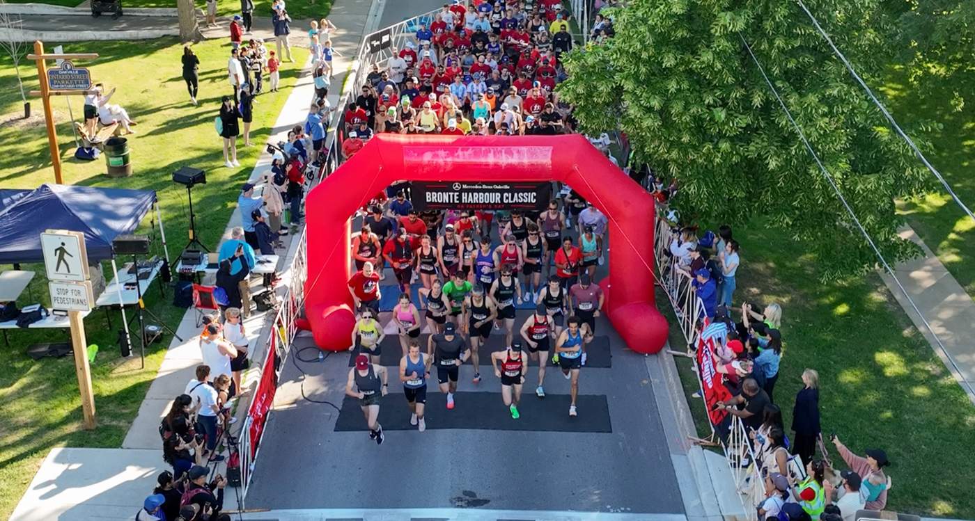 Aerial drone photo of runners filling Ontario Street at the start of the Mercedes-Benz Oakville Bronte Harbour Classic 5K, Oakville